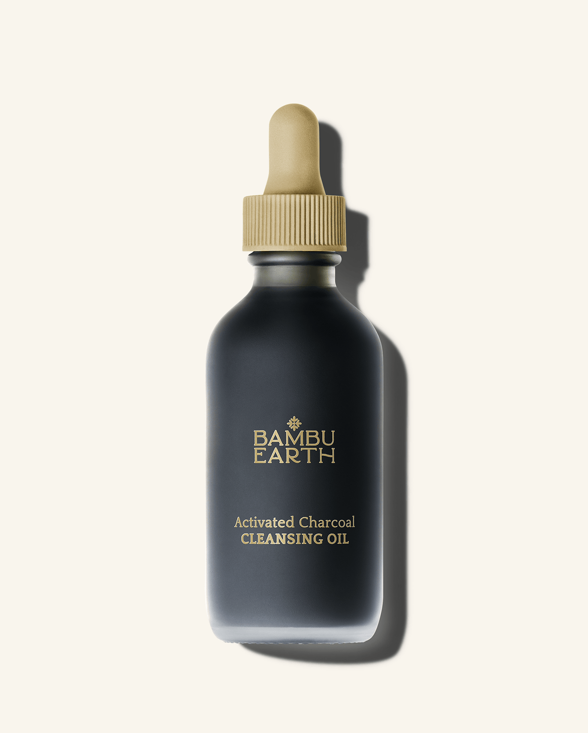 Bambu Earth Activated Charcoal Cleansing Oil - A dark charcoal gray bottle of Bamboo Earth Activated Charcoal Cleansing Oil
