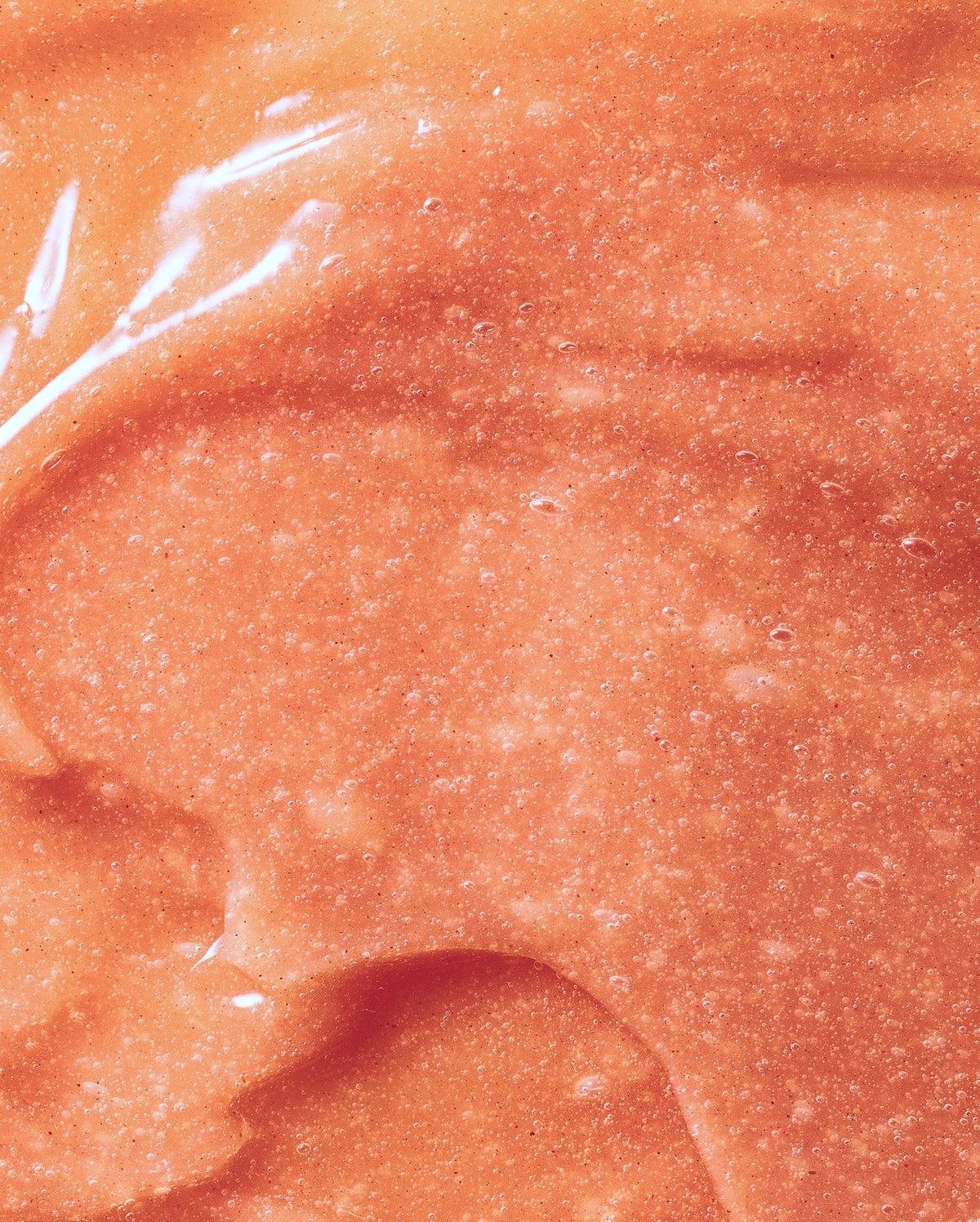 Bambu Earth Papaya Enzyme Exfoliating Mask - Close-up of a textured orange surface