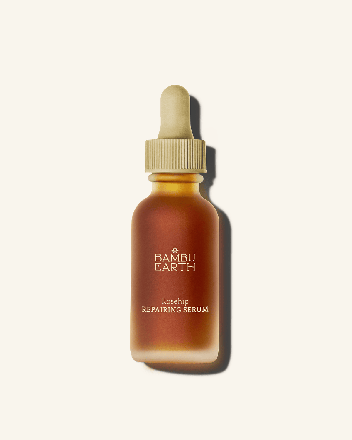 Bambu Earth Rosehip Repairing Facial Serum - Bambu Earth Rosehip Repairing Serum in an amber glass dropper bottle with a