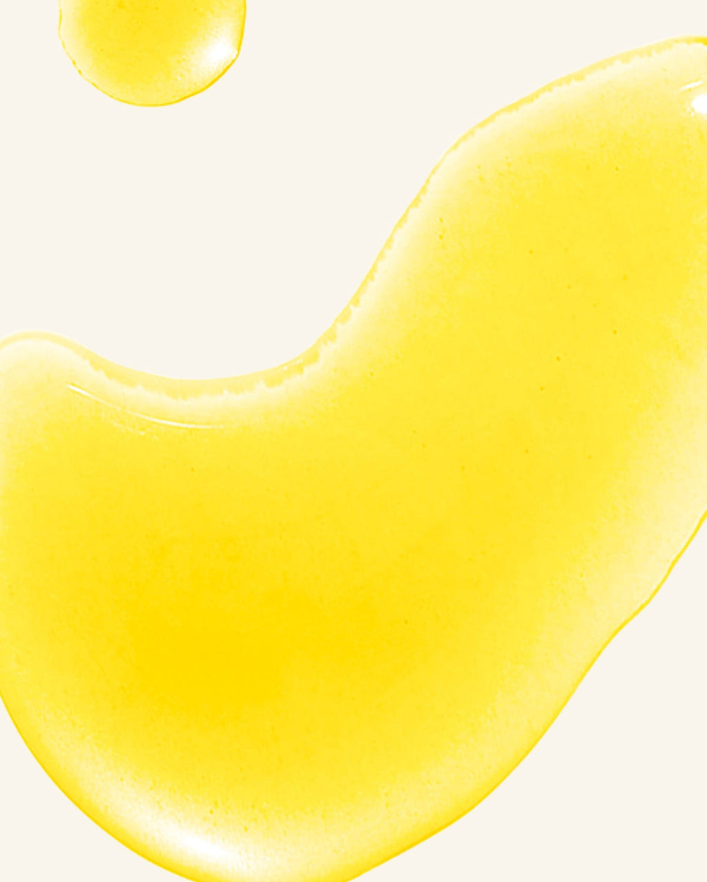 Bambu Earth Rosehip Repairing Facial Serum - Close-up of yellow paint or cream on a white background