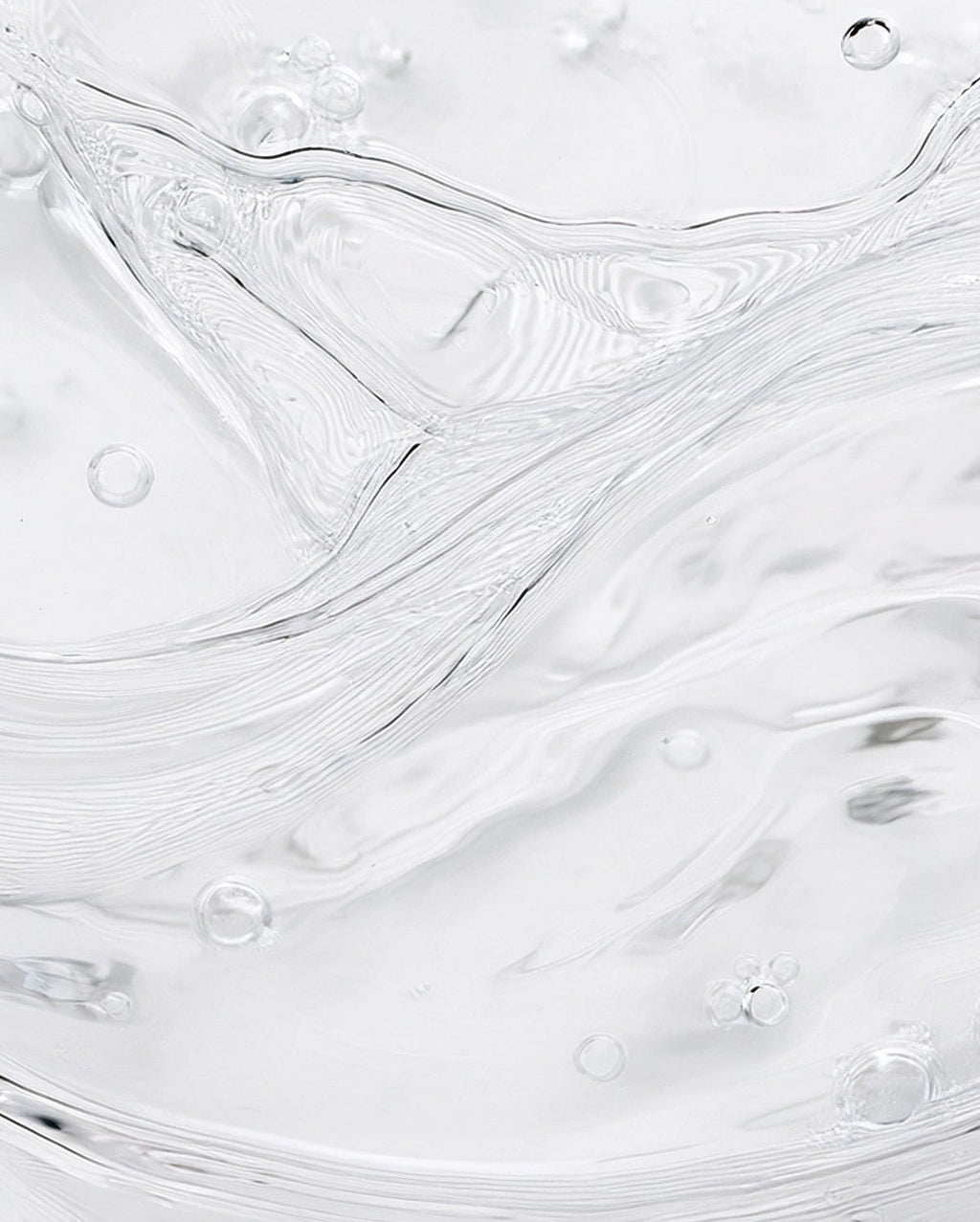 Bambu Earth Rosewater Cleanser - Close-up of white paint texture with subtle swirls and bubbles