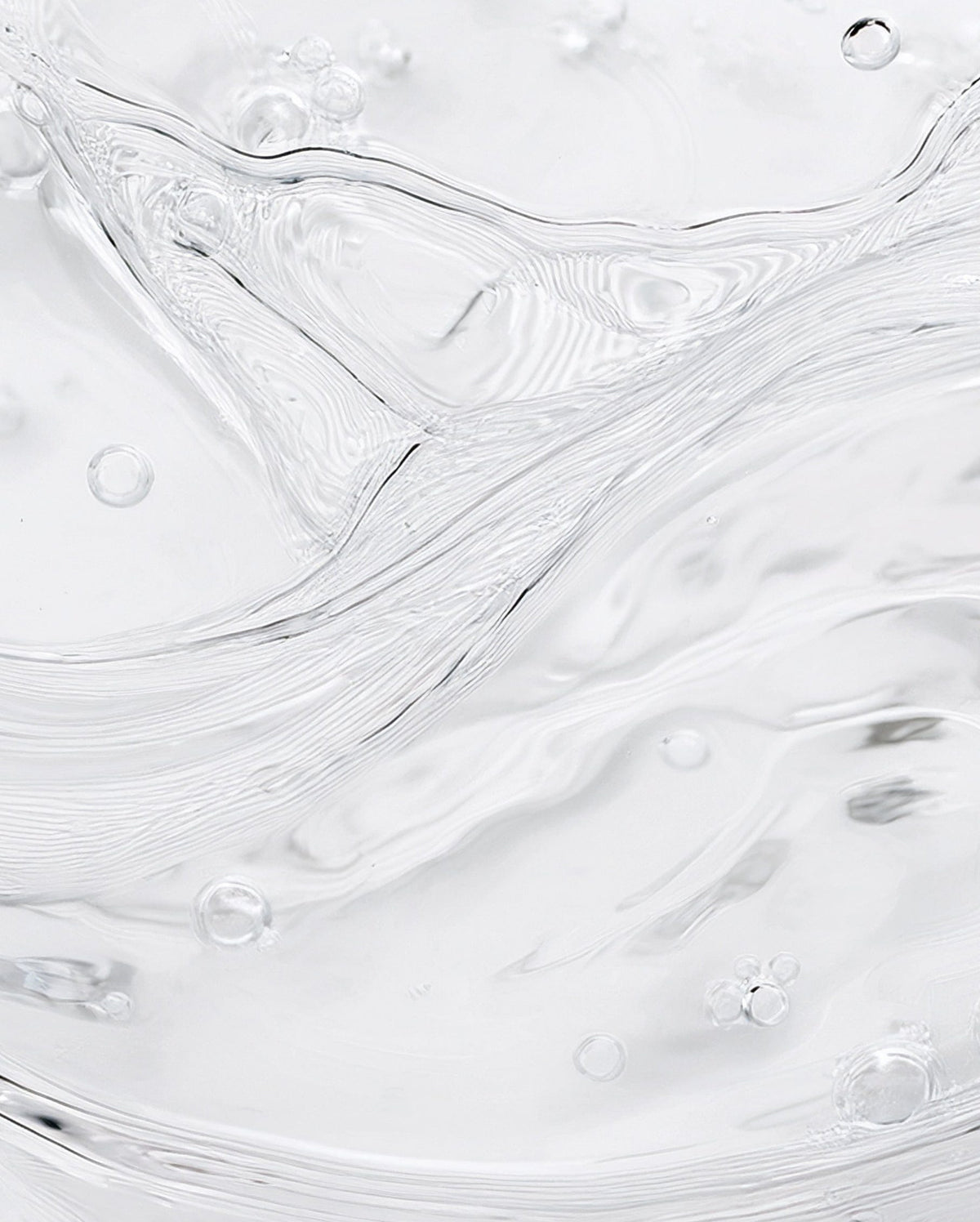 Bambu Earth Rosewater Cleanser - Close-up of white paint texture with subtle swirls and bubbles